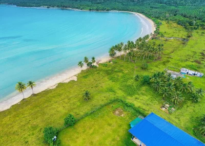 Overhead drone view of the beachfront property and sea of Tagolango 1